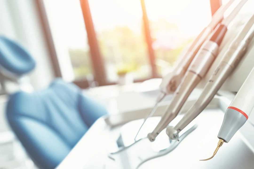 closeup of dental office tools and chair